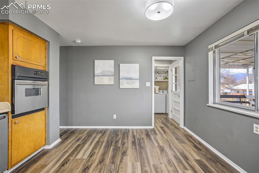 Image 15 of 37: Kitchen flows with the lining room and dining room