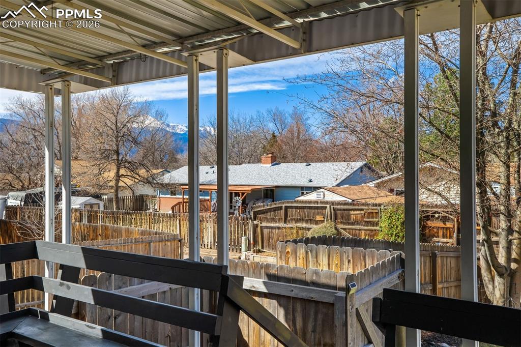 Image 34 of 37: Wood deck off the kitchen perfect for entertaining