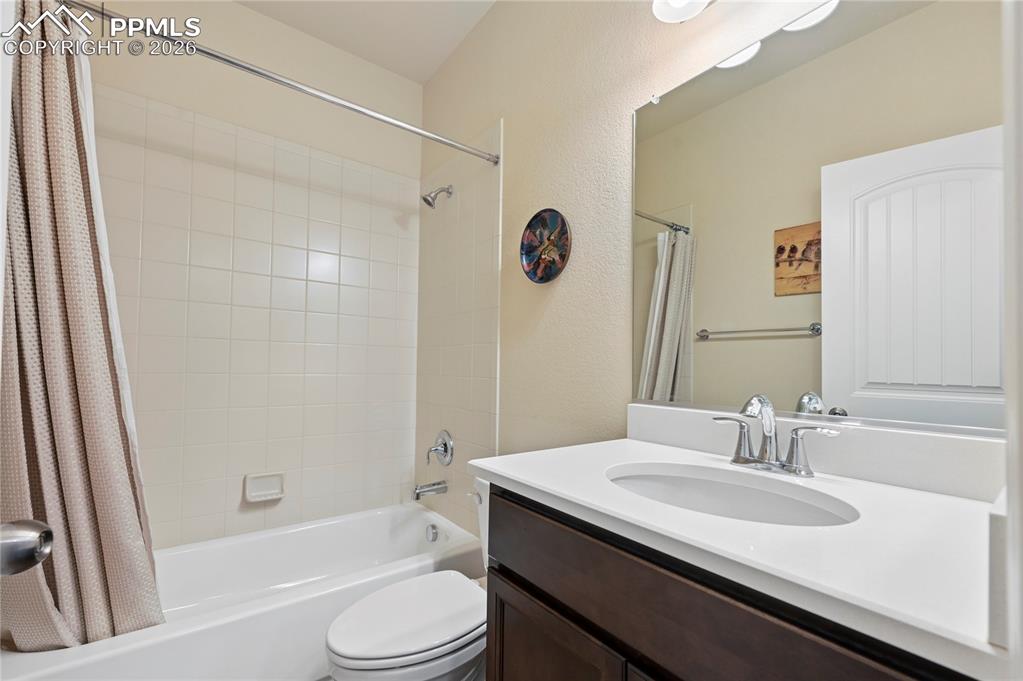 Image 17 of 37: This full bathroom is the second full bathroom on the main level, and you