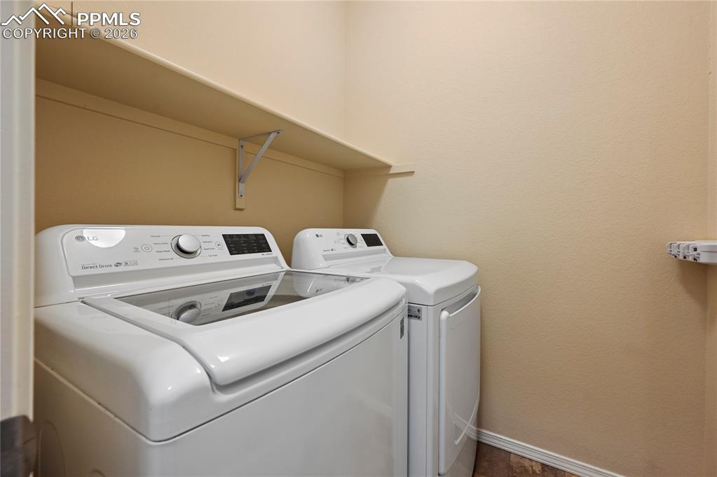 Image 18 of 37: The laundry room is on the main floor, just inside the garage door.  So if 