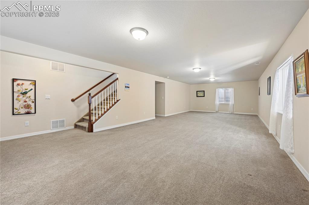 Image 20 of 37: This family room is so huge that some people turn the far end into a 5th be