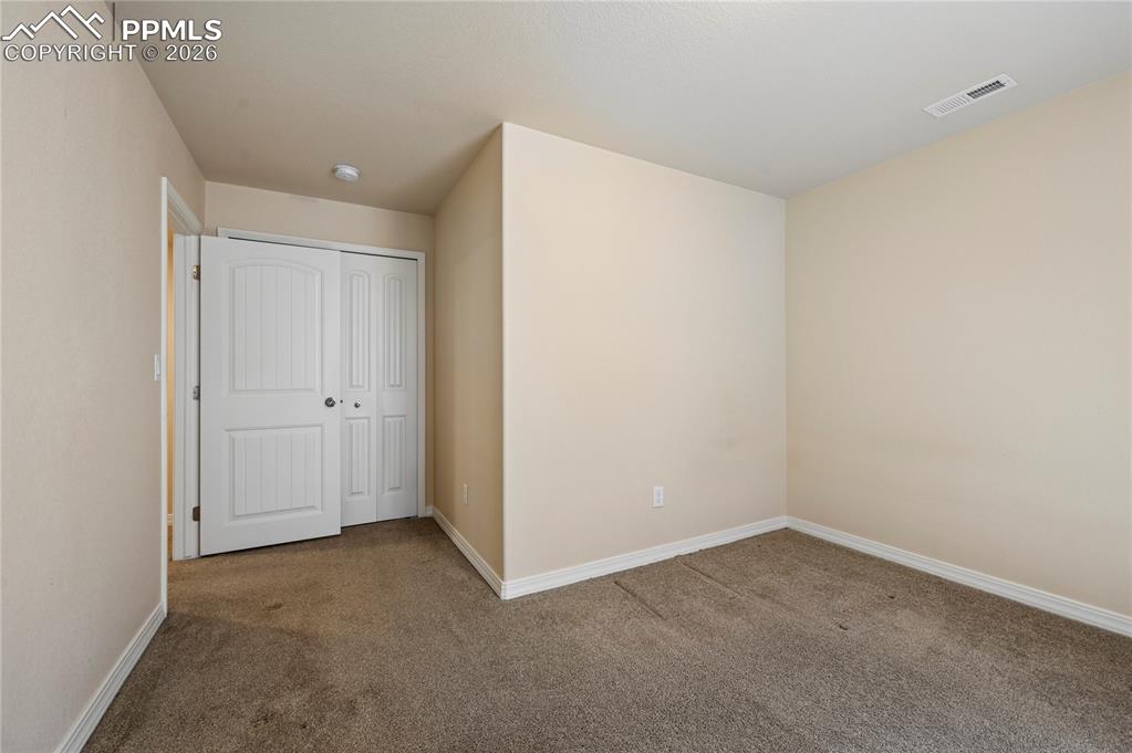 Image 25 of 37: Bedroom #4 might make a good home office or podcast recording studio if you