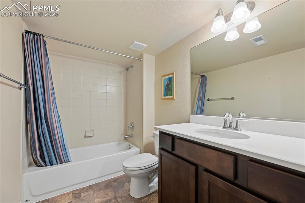 Image 26 of 37: Bathroom #3 is a full bathroom in the basement, right across the hallway fr