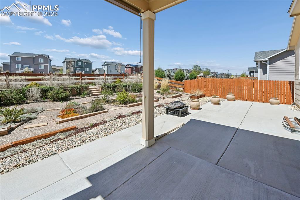 Image 27 of 37: Just outside the patio doors from your dining room on the main level is a p