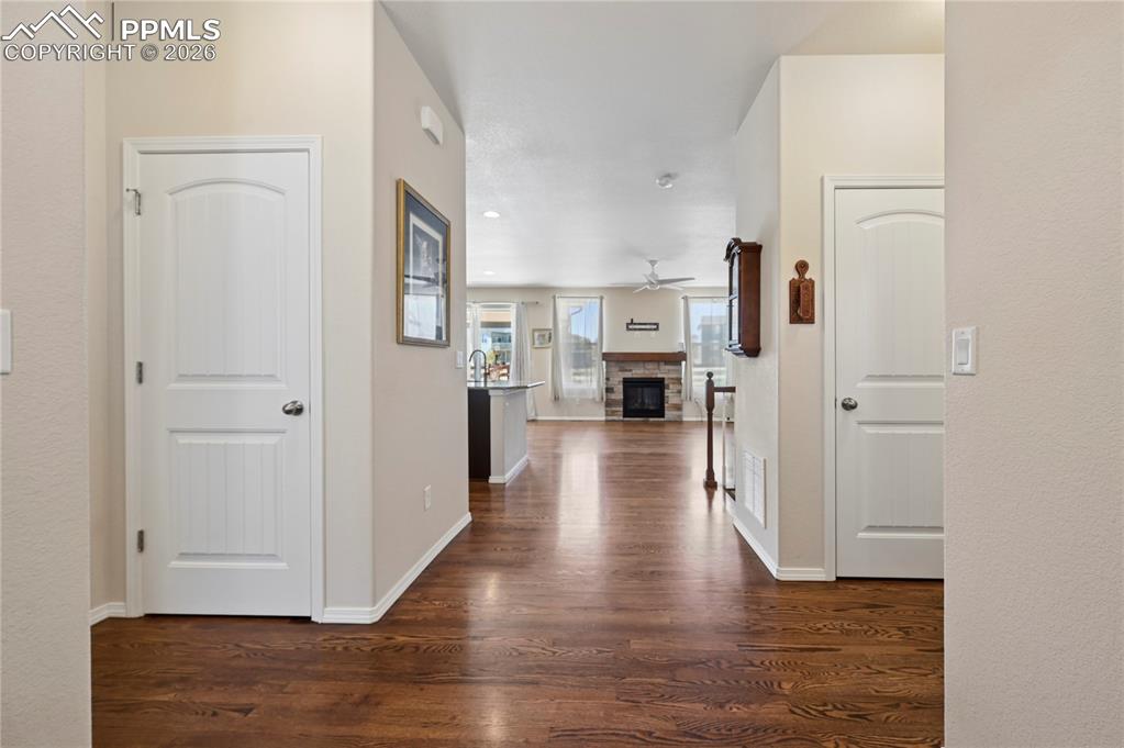 Image 3 of 37: The entryway welcomes you with broad hallways leading to inviting living sp