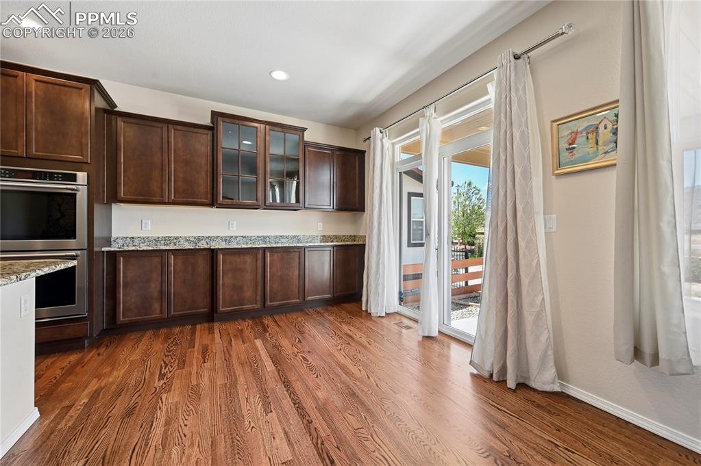 Image 8 of 37: The dining space enjoys plenty of extra storage without needing extra furni