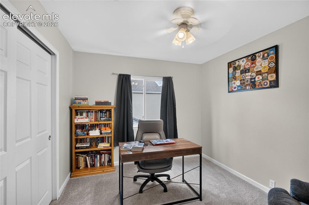 Image 15 of 30: Bedroom 4, currently a home office