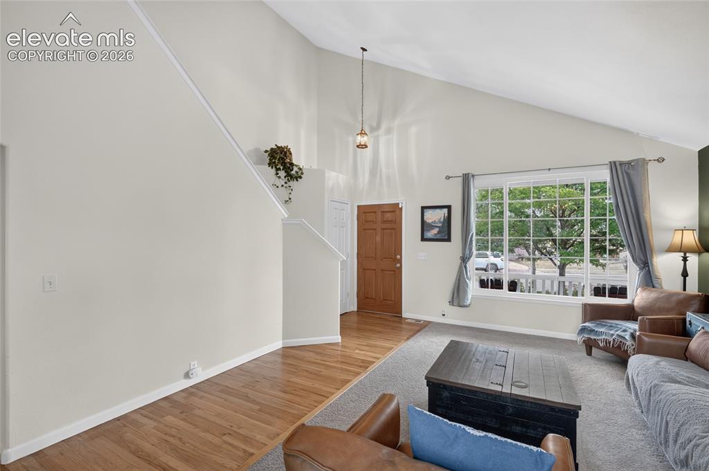 Image 3 of 30: Entry with vaulted ceiling