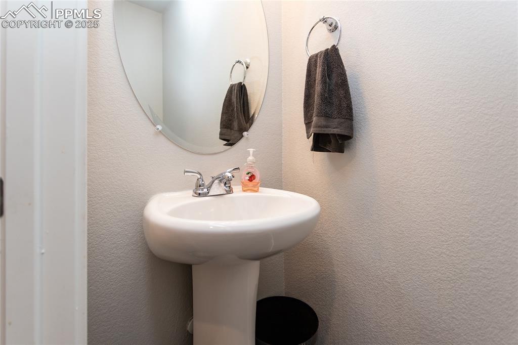 Image 17 of 48: Half bath on the entry level