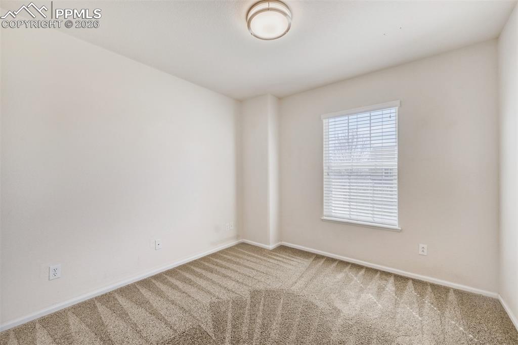 Image 18 of 28: Secondary upper bedroom.