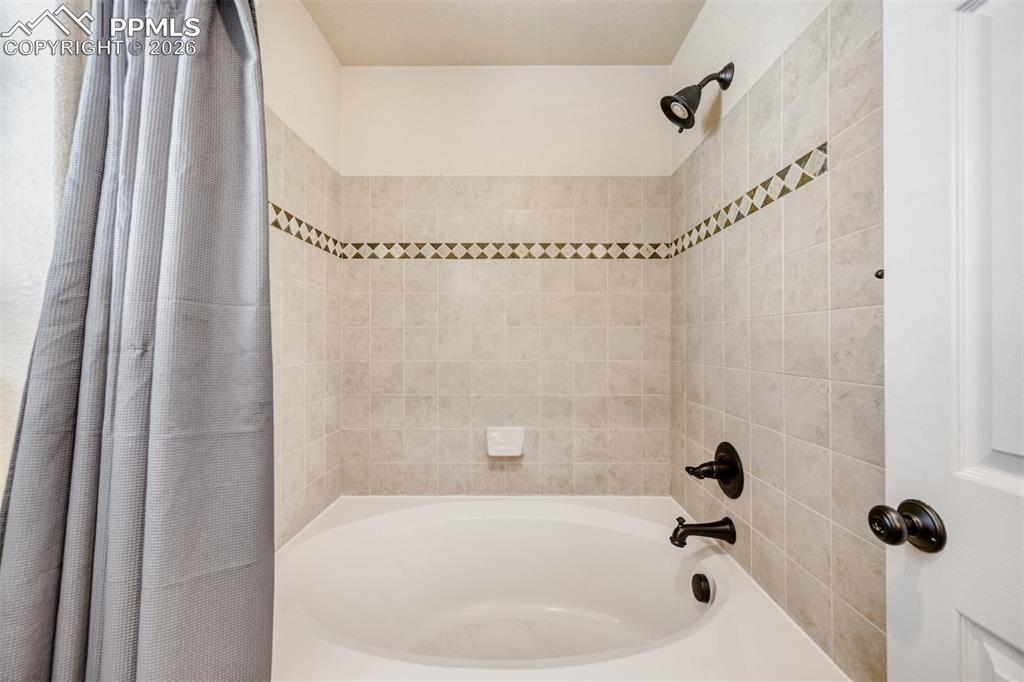 Image 22 of 28: Upper hallway full bathroom.