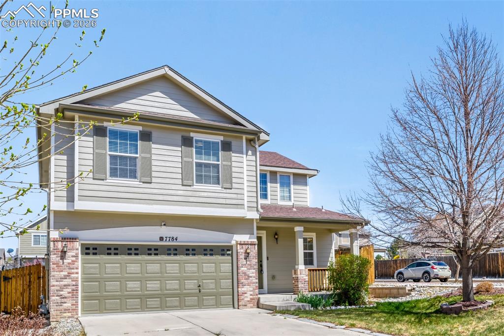 Image 26 of 28: Fenced backyard with a wooden deck