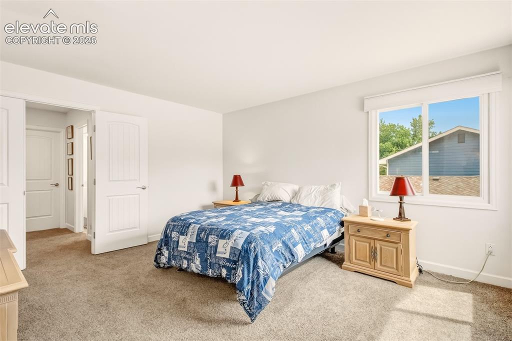 Image 12 of 39: Primary bedroom upper level with walk in 4 piece bathroom and walk in close