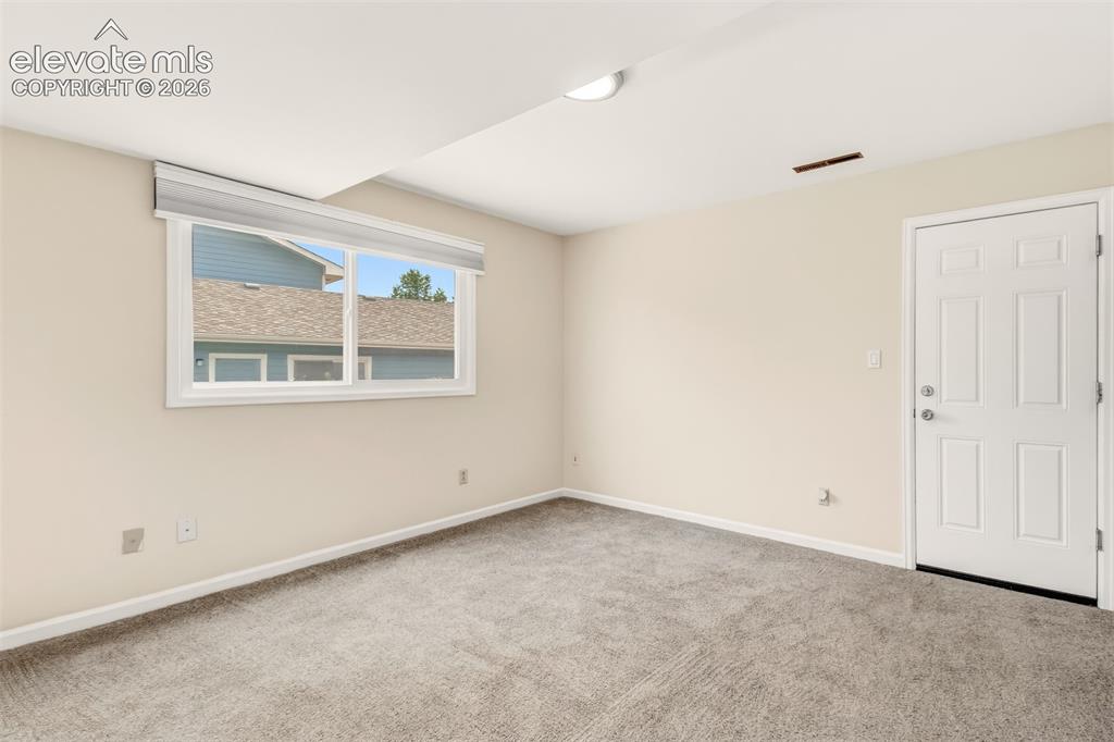 Image 23 of 39: Office/Bonus room on lower level