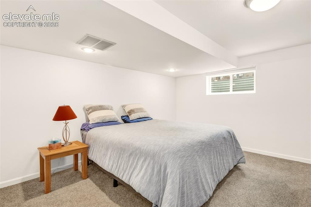 Image 25 of 39: Non-conforming bedroom in basement