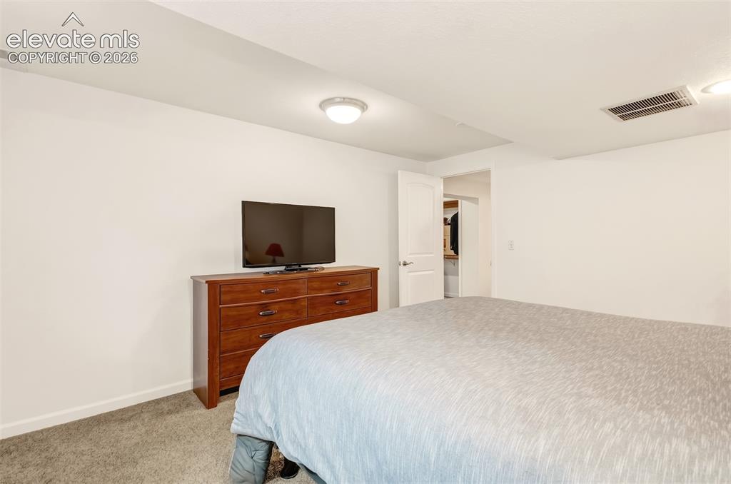 Image 26 of 39: Non-conforming bedroom in basement