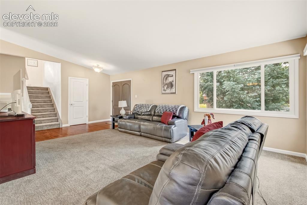 Image 3 of 39: Spacious living room with tons a natural light