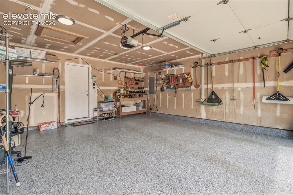 Image 31 of 39: 2 car attached garage w/ 220 outlet EV charger