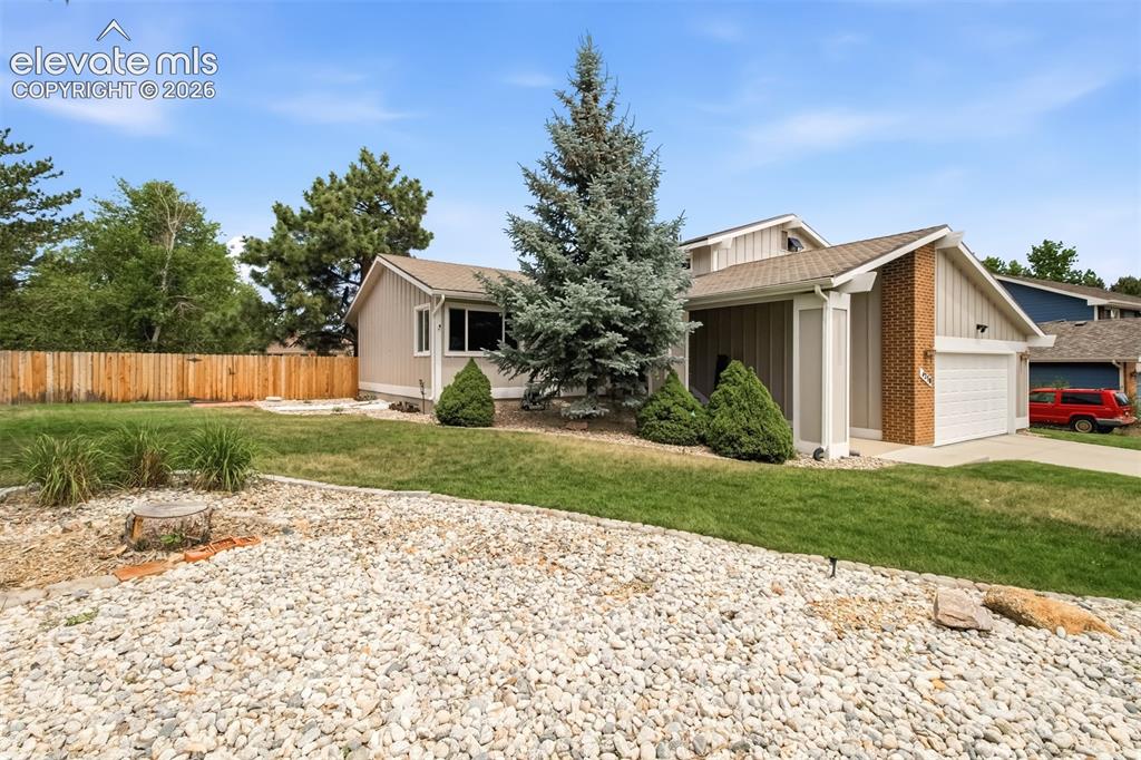 Image 37 of 39: Front of Home with spacious front yard