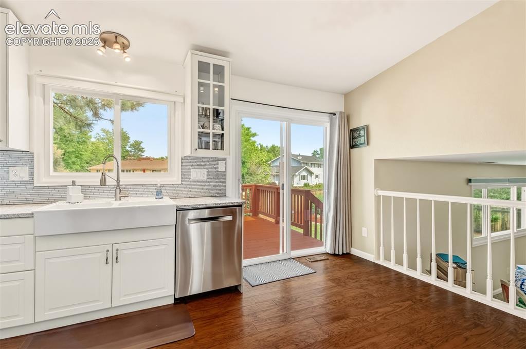 Image 7 of 39: Kitchen with quartz countertops, matching stainless steel appliances and a
