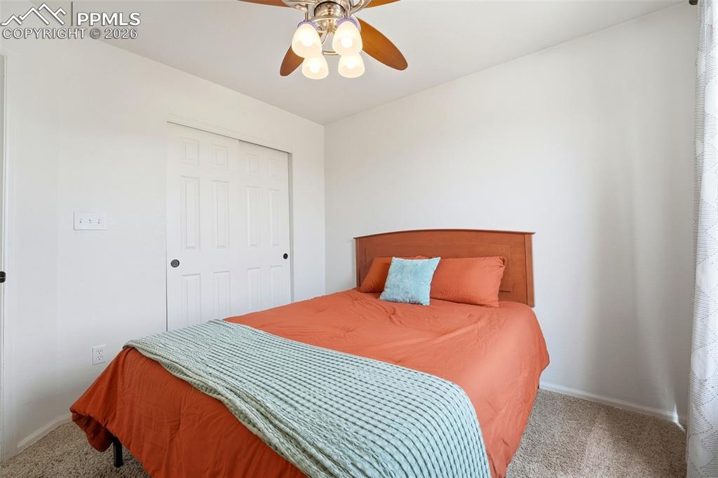 Image 20 of 44: Neutral wall finishes with a ceiling fan light fixture
