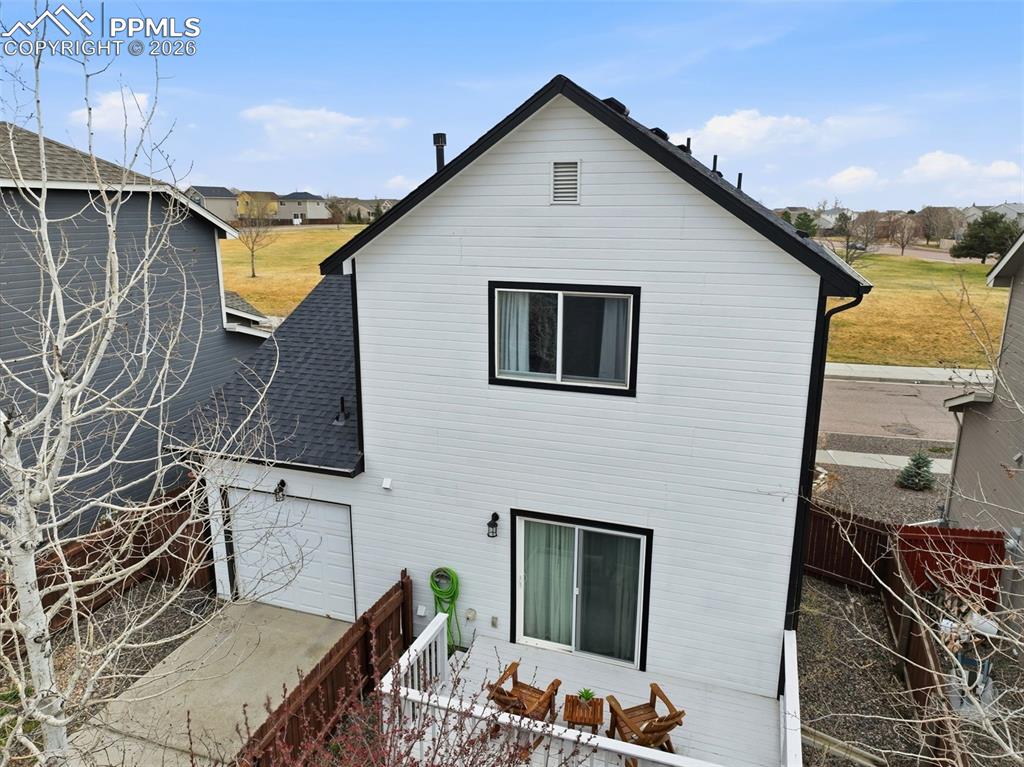Image 37 of 44: White vertical siding exterior with contrasting black trim