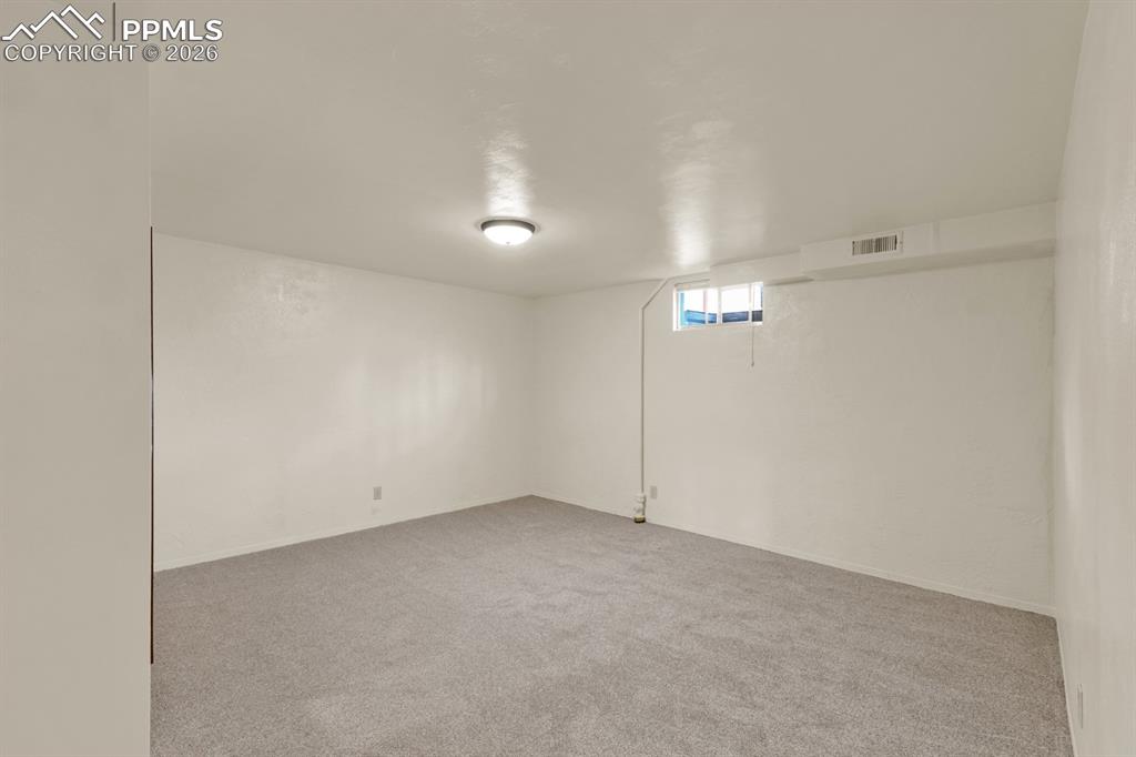 Image 18 of 25: Basement bedroom- BRAND NEW carpet