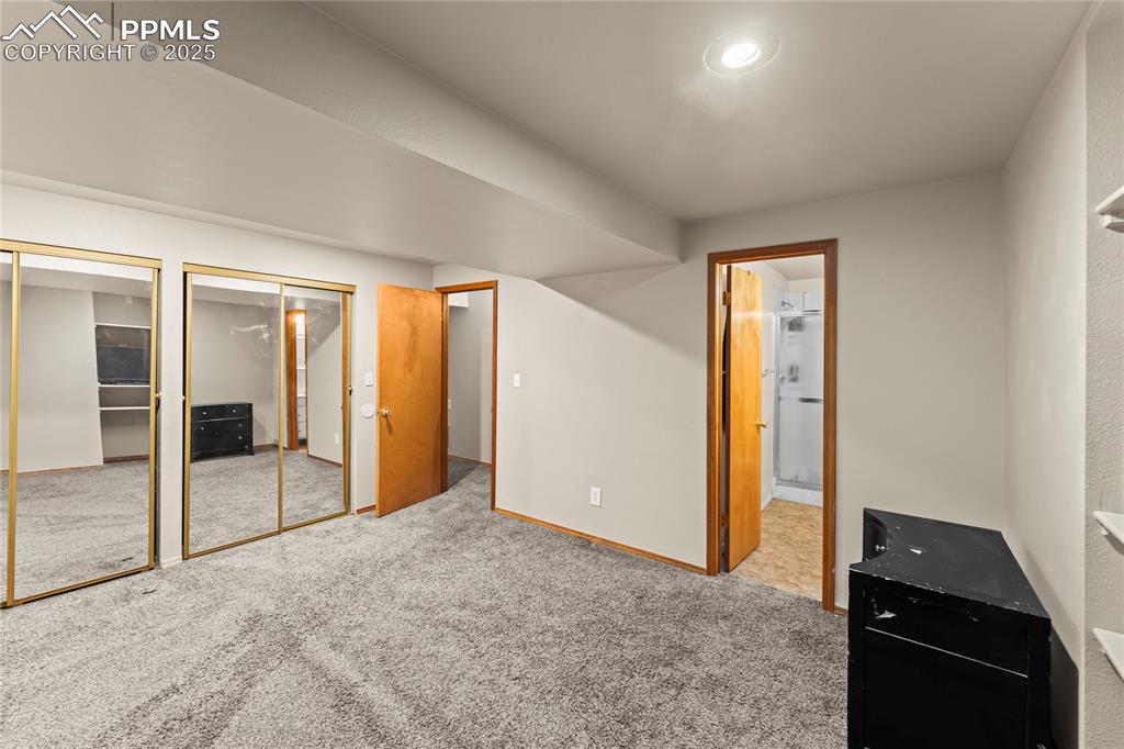 Image 18 of 38: Basement bedroom with en-suite