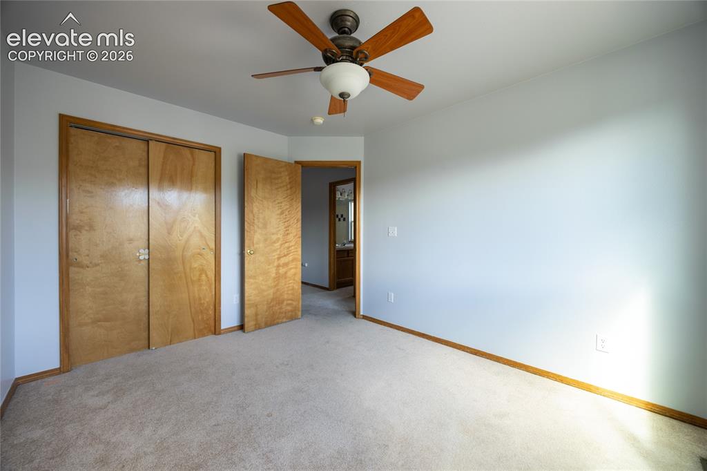 Image 20 of 34: Neutral carpet flooring