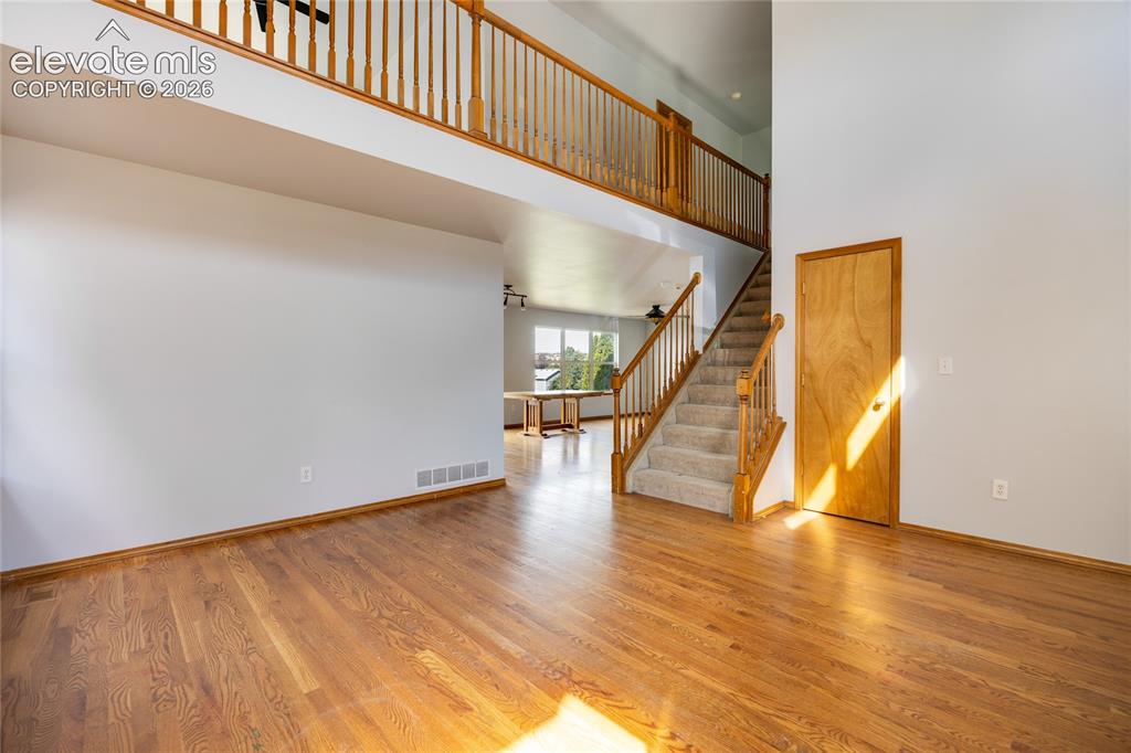 Image 4 of 34: Hardwood flooring throughout the main level