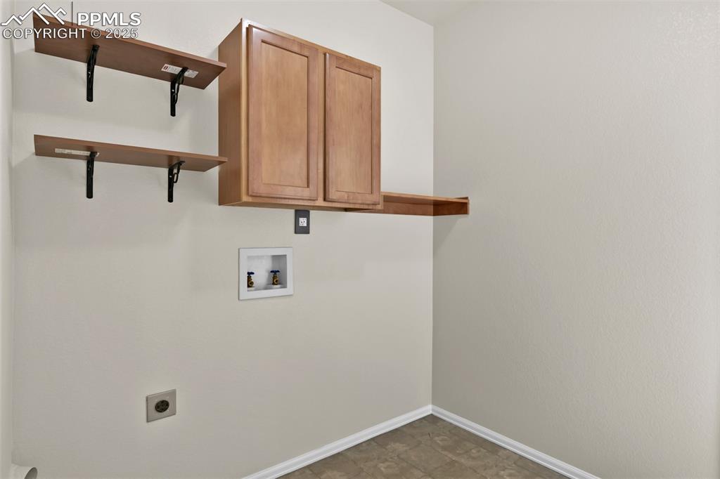 Image 31 of 50: Laundry area featuring hookup for a washing machine, electric dryer hookup,
