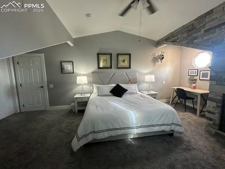 Image 4 of 10: Bedroom with dark carpet and ceiling fan
