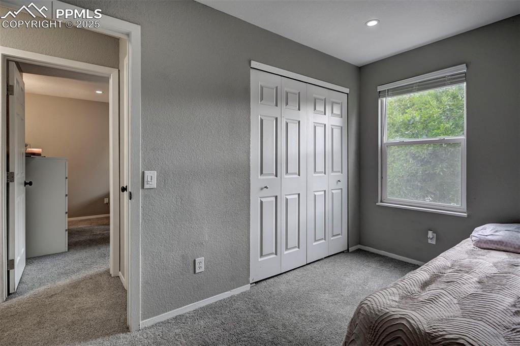 Image 15 of 33: Carpeted bedroom with a closet and recessed lighting
