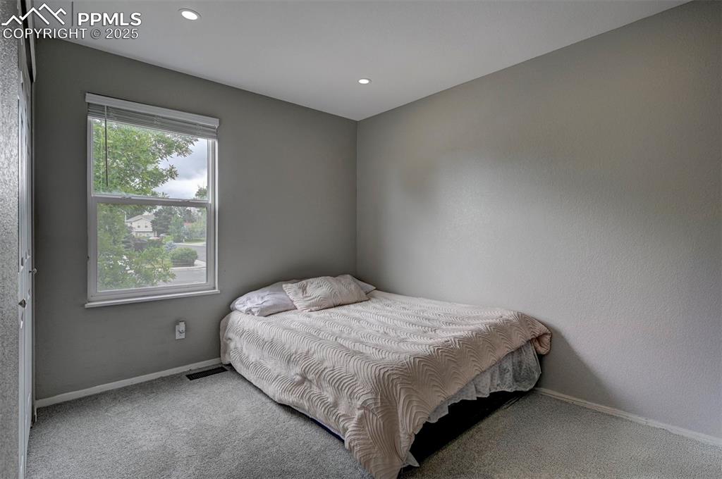 Image 21 of 33: Bedroom featuring carpet flooring and recessed lighting