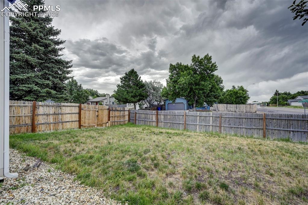 Image 31 of 33: View of fenced backyard