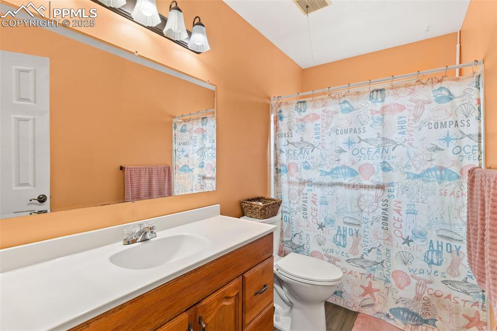 Image 24 of 36: Bathroom featuring vanity and toilet