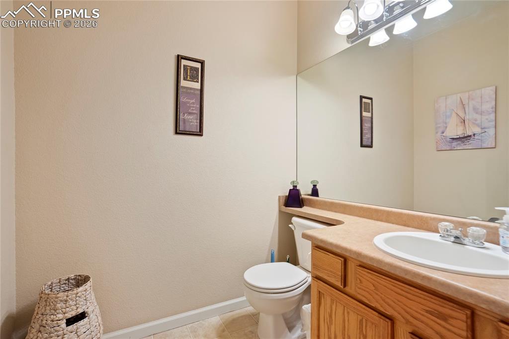 Image 14 of 42: Bathroom with vanity and light tile patterned floors