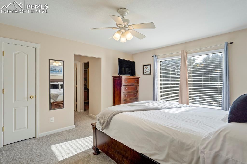 Image 19 of 42: Bedroom featuring light colored carpet and a ceiling fan