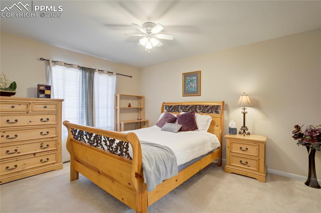 Image 25 of 42: Bedroom featuring light colored carpet and ceiling fan
