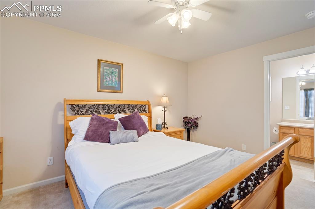Image 27 of 42: Bedroom featuring light carpet and a ceiling fan