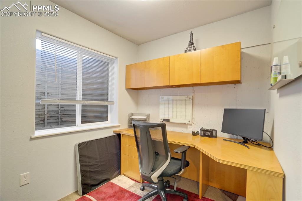 Image 37 of 42: Home office featuring built in study area