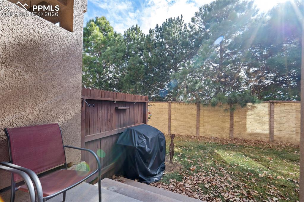 Image 40 of 42: View of fenced backyard