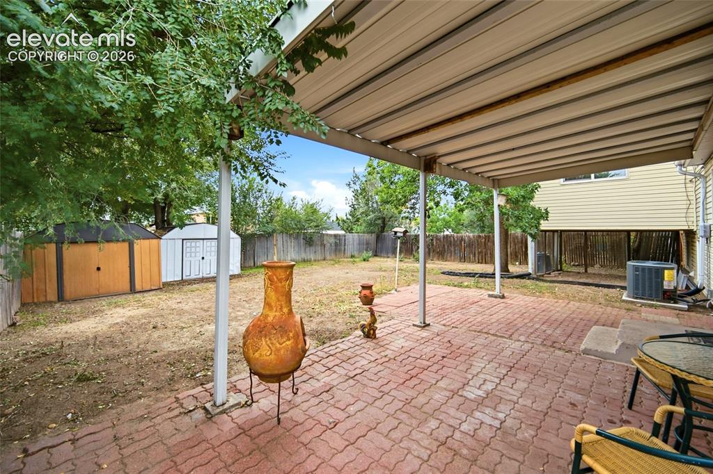 Image 16 of 47: Covered Patio and Off the kitchen for your BBQ