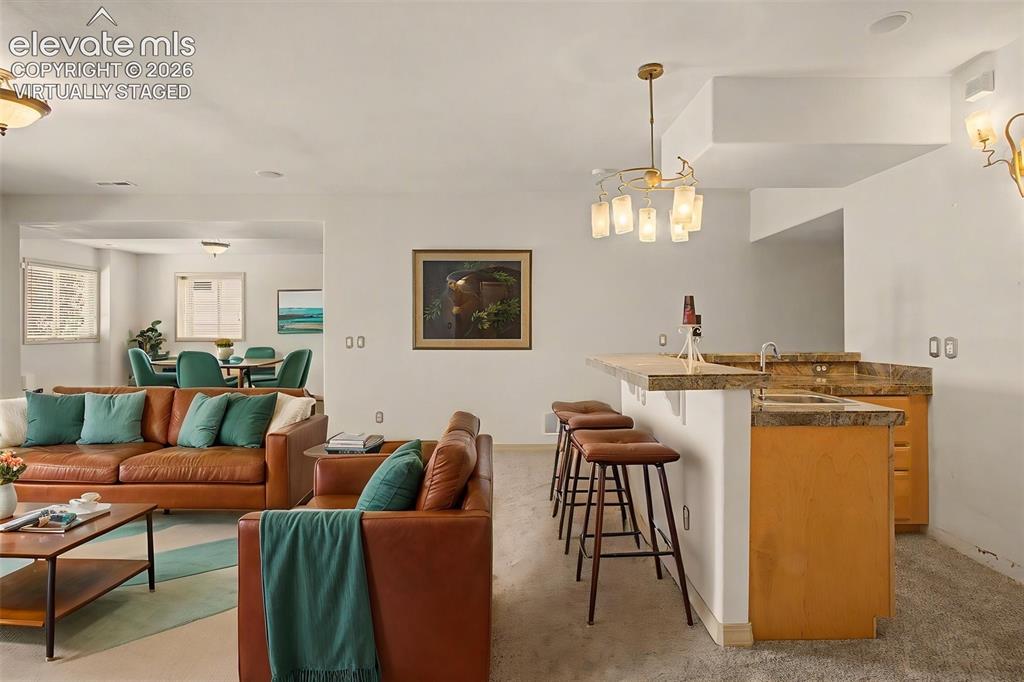 Image 26 of 50: Virtually Staged FR with Wet Bar