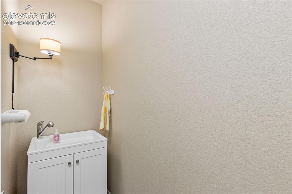 Image 18 of 39: Utility sink in laundry room