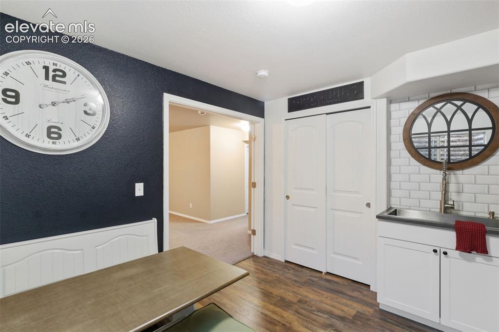 Image 27 of 39: Additonal kitchen and dining area in basement
