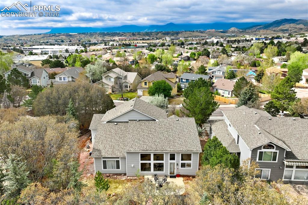 Image 30 of 44: Aerial perspective showcasing a residential property with a multi-level roo