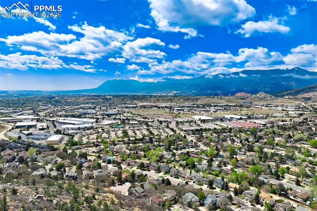 Image 42 of 44: Expansive aerial perspective showcasing a residential neighborhood with sur