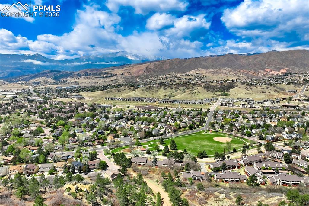 Image 43 of 44: Expansive community featuring mature trees, residential properties, varied 