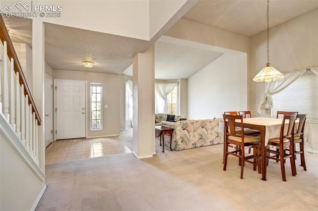 Image 5 of 44: Dining room and entry.